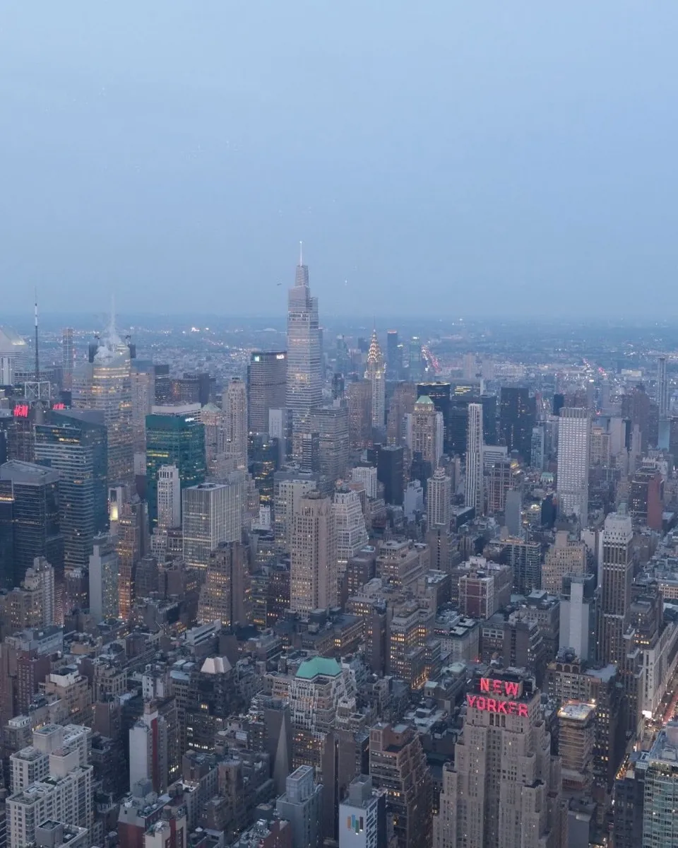 Midtown Manhattan at dusk from above, the Empire State Building on the right